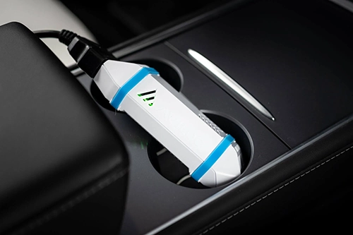The AVILOO test box connected to an electric car's OBD-2 port